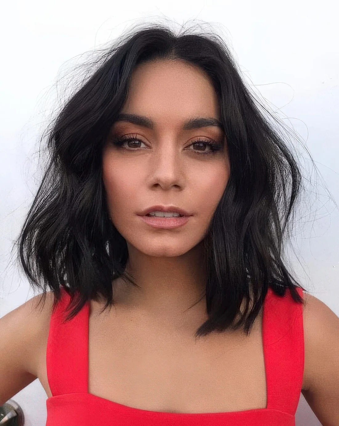 Messy and choppy long bob with center part.