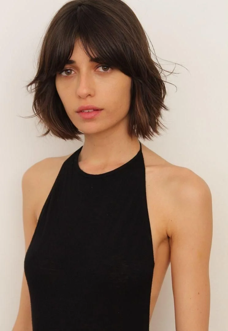 chin wavy chestnut bob with curtain fringe shown as a choppy bob hairstyles for fine hair idea
