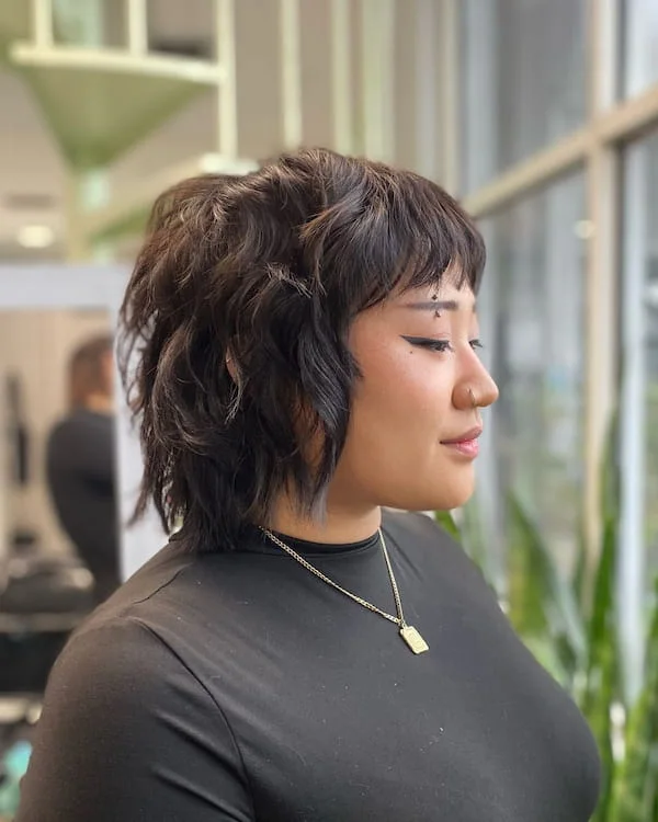 shoulder wavy chestnut shag with curtain fringe shown as a choppy bob hairstyles for fine hair idea, featuring wavy texture
