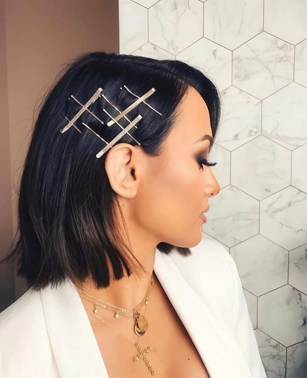 Photo showing metallic hair pins, with the hairstyle clearly visible.