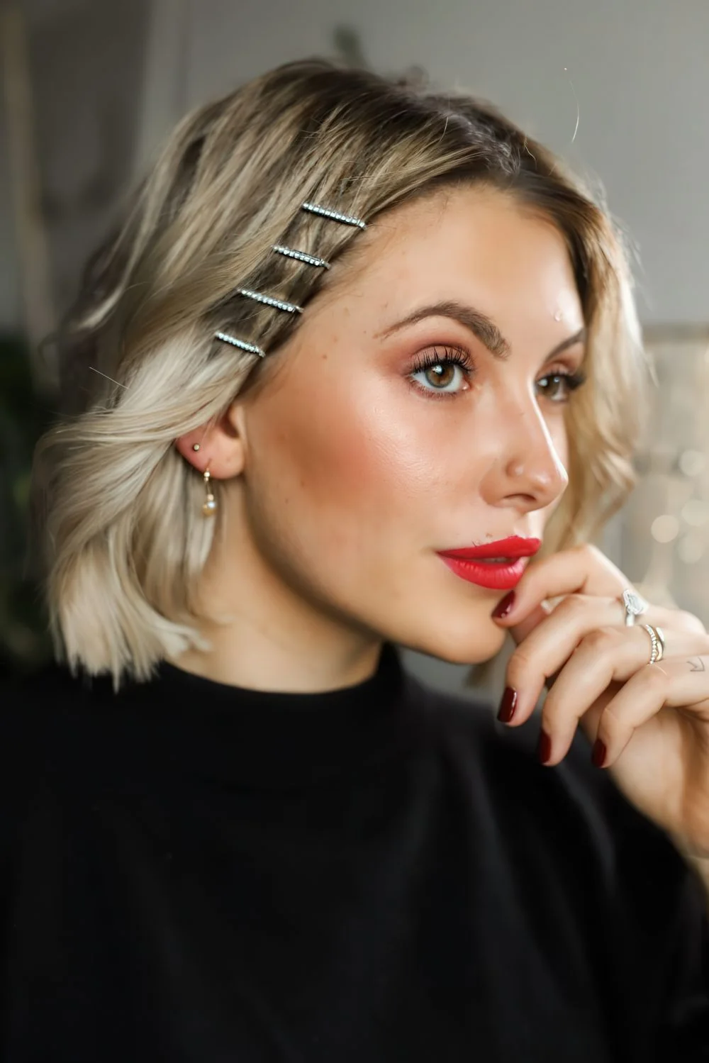 Photo showing rhinestone hairpins, with the hairstyle clearly visible.