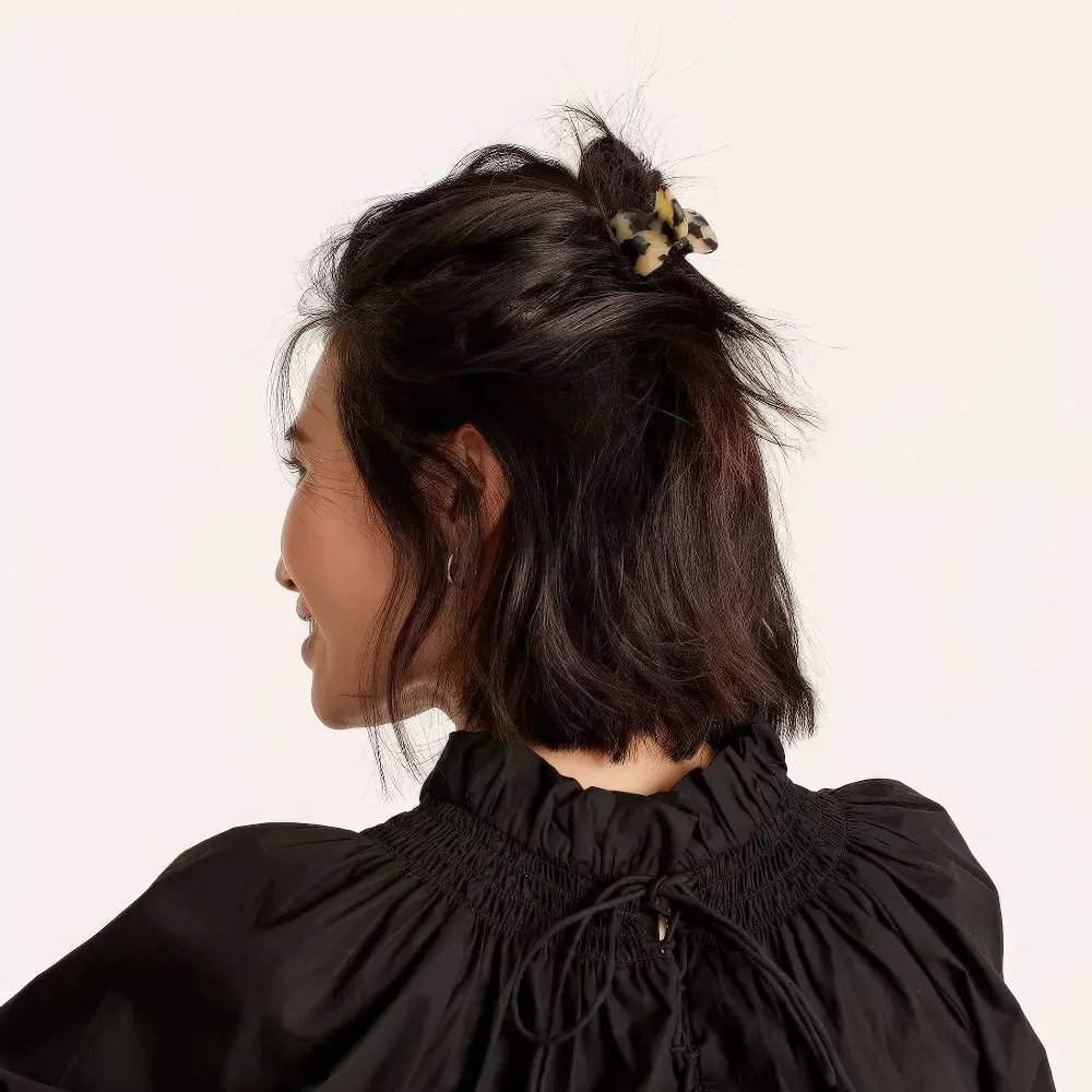 Photo showing messy half updo claw clip, with the hairstyle clearly visible.