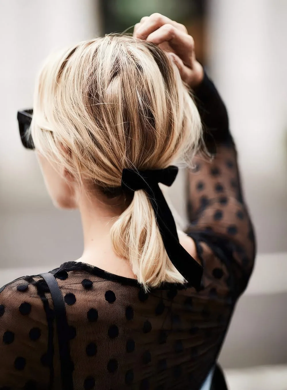 Photo showing ponytail bow, with the hairstyle clearly visible.