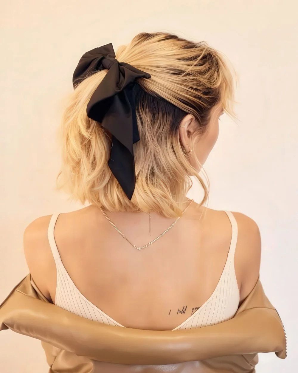 Photo showing large bow, with the hairstyle clearly visible.