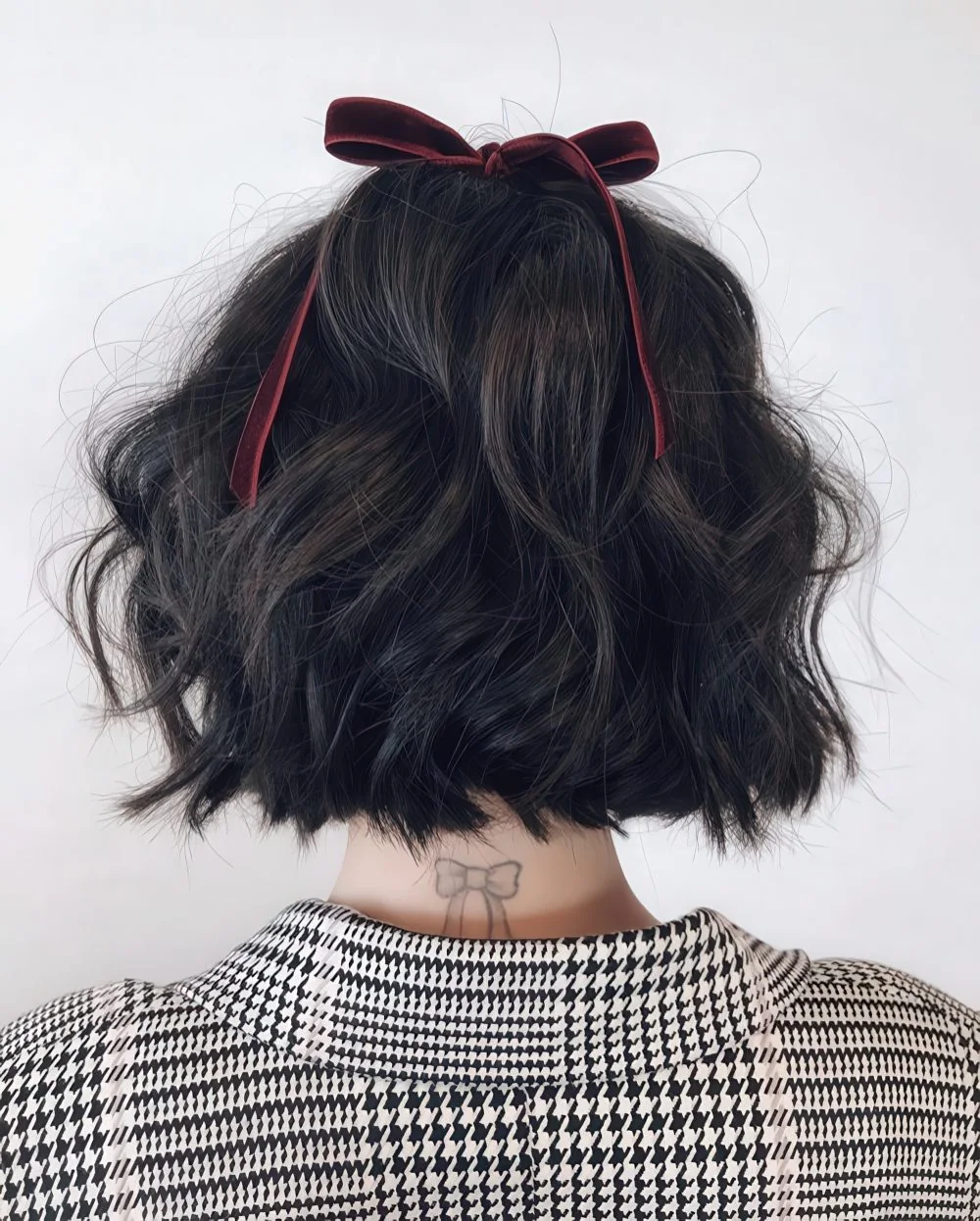 Photo showing half updo burgundy bow, with the hairstyle clearly visible.