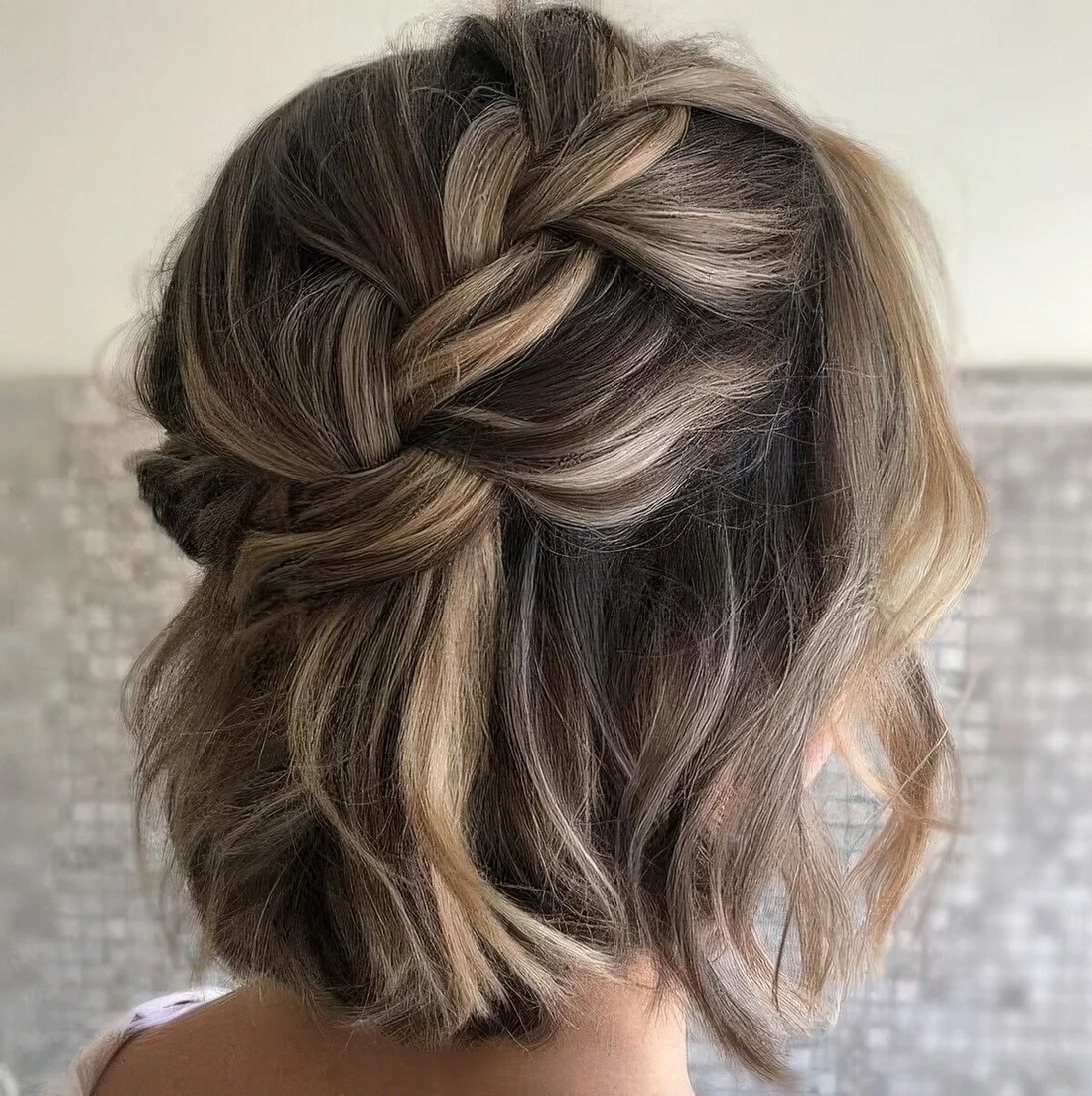 Loose braided halo half updo with waves and some volume.