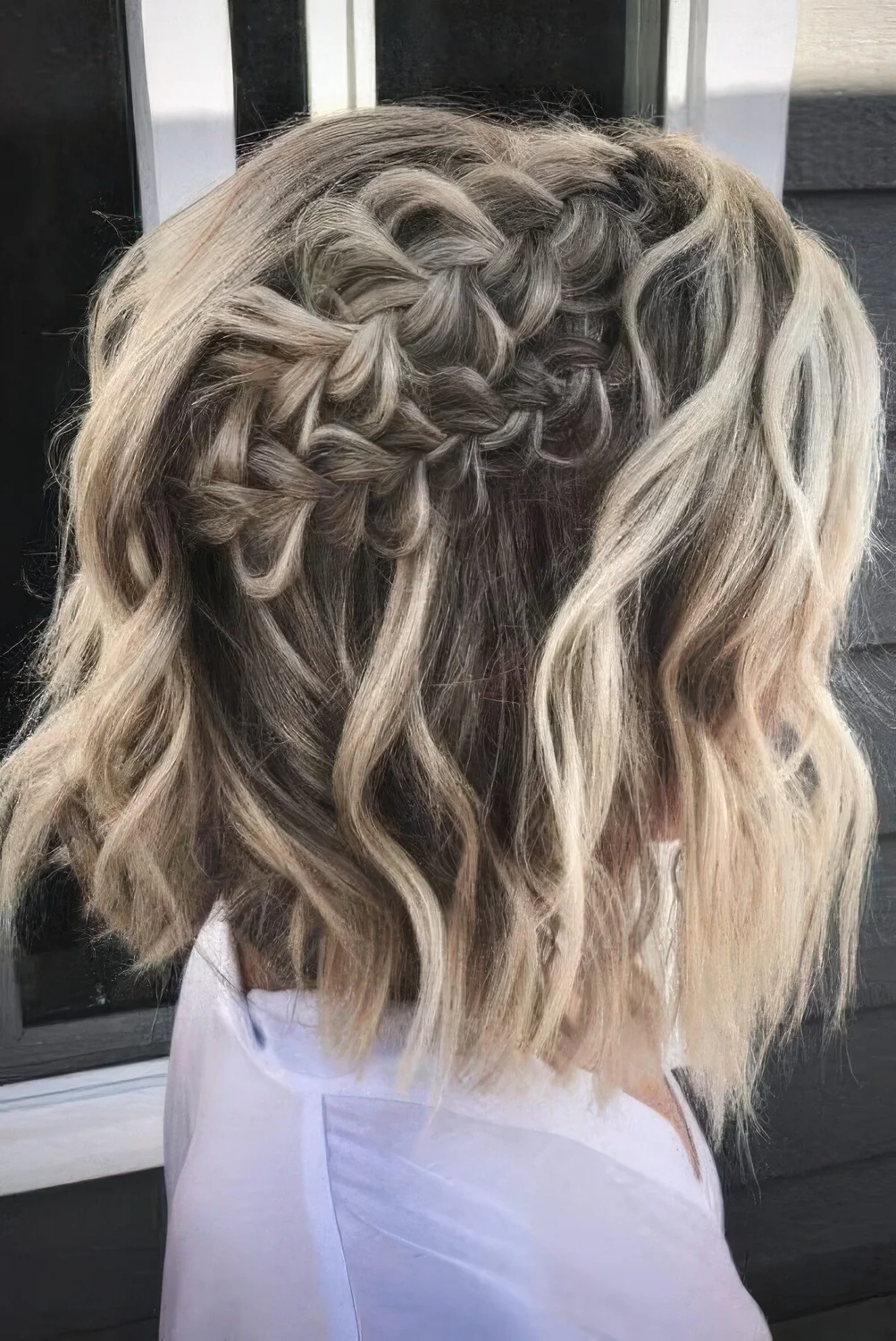 Long bob with blonde balayage and two volumetric braids on top plus waves down.