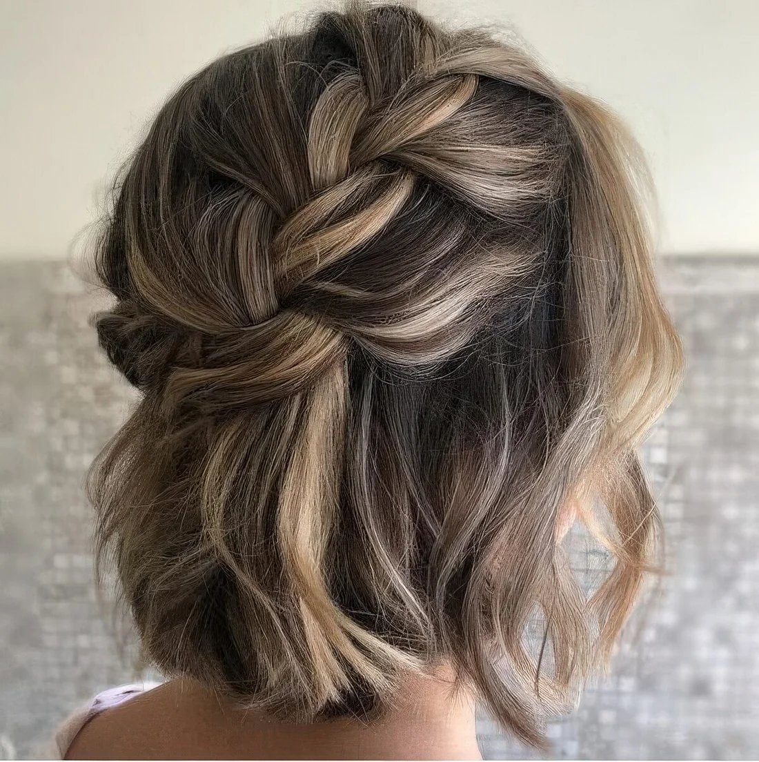 Loose braided halo half updo with waves and some volume.