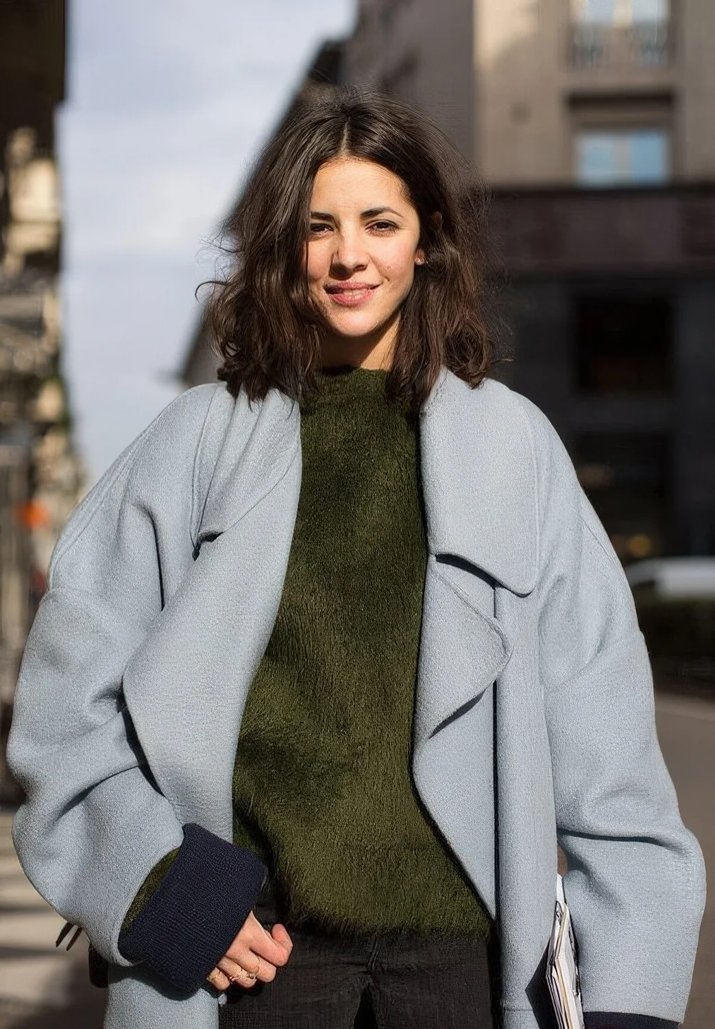 Dark brown wavy collarbone bob with center part.
