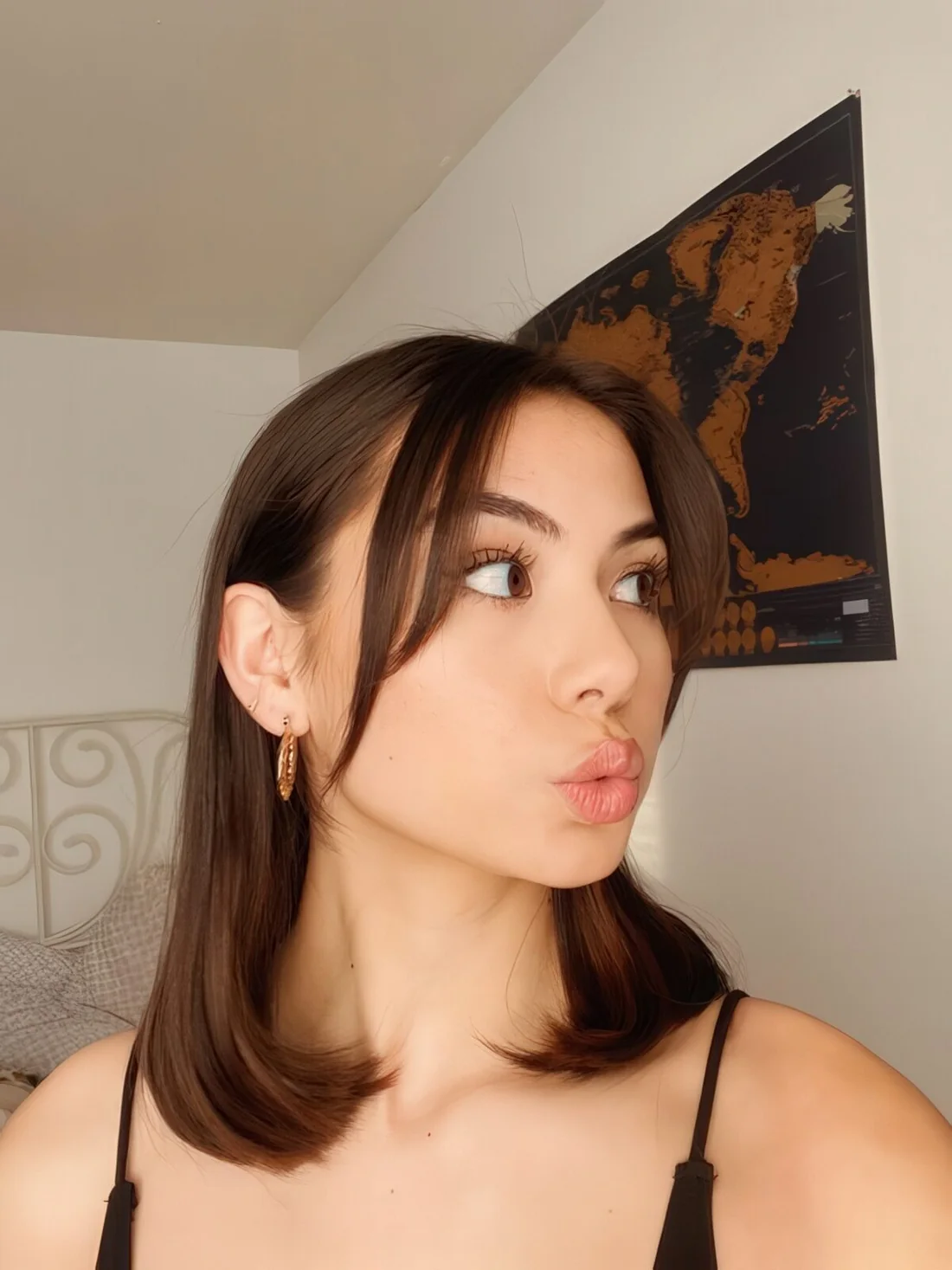 Medium-length dark hair with curtain bangs.