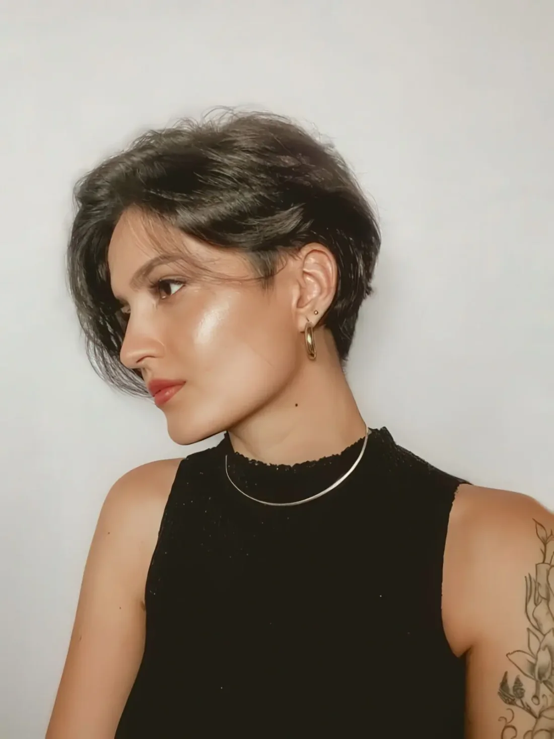 Photo showing black long pixie, with the hairstyle clearly visible.