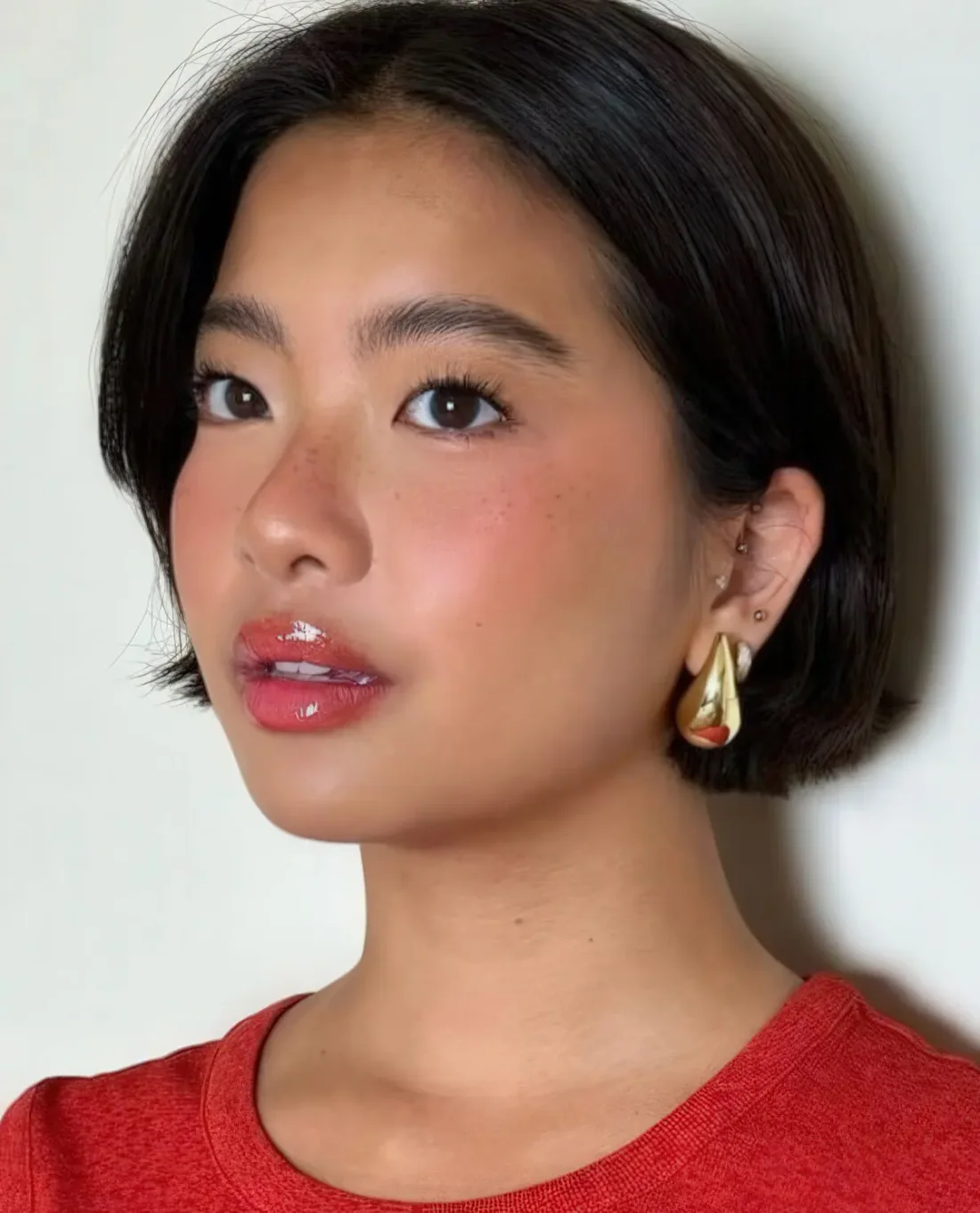 Photo showing black ear-length bob, with the hairstyle clearly visible.
