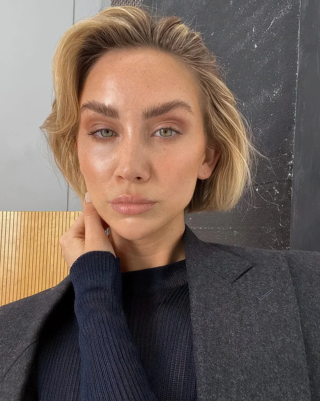 Photo showing blonde lip length bob, with the hairstyle clearly visible.