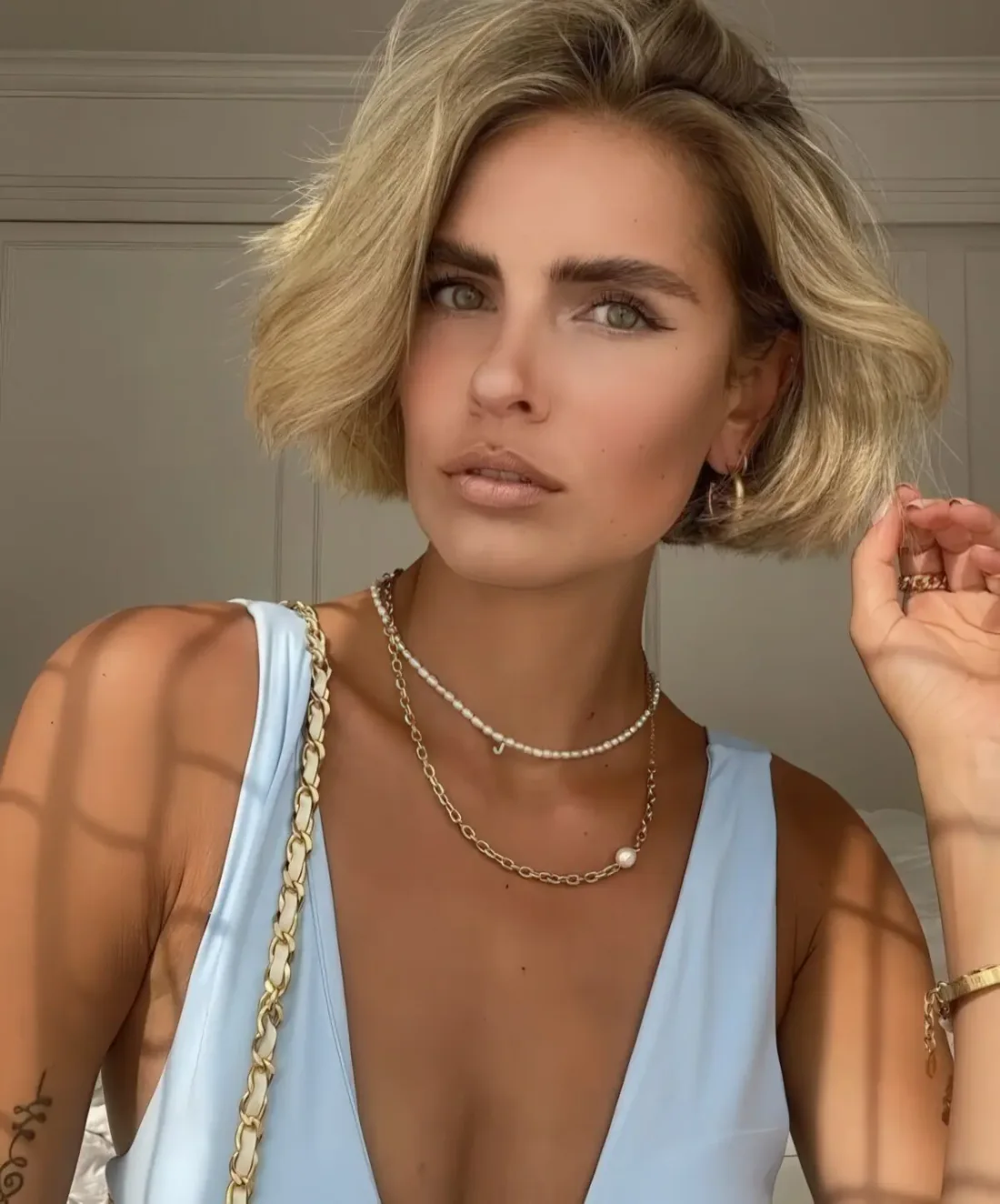 Photo showing blonde bob, with the hairstyle clearly visible.
