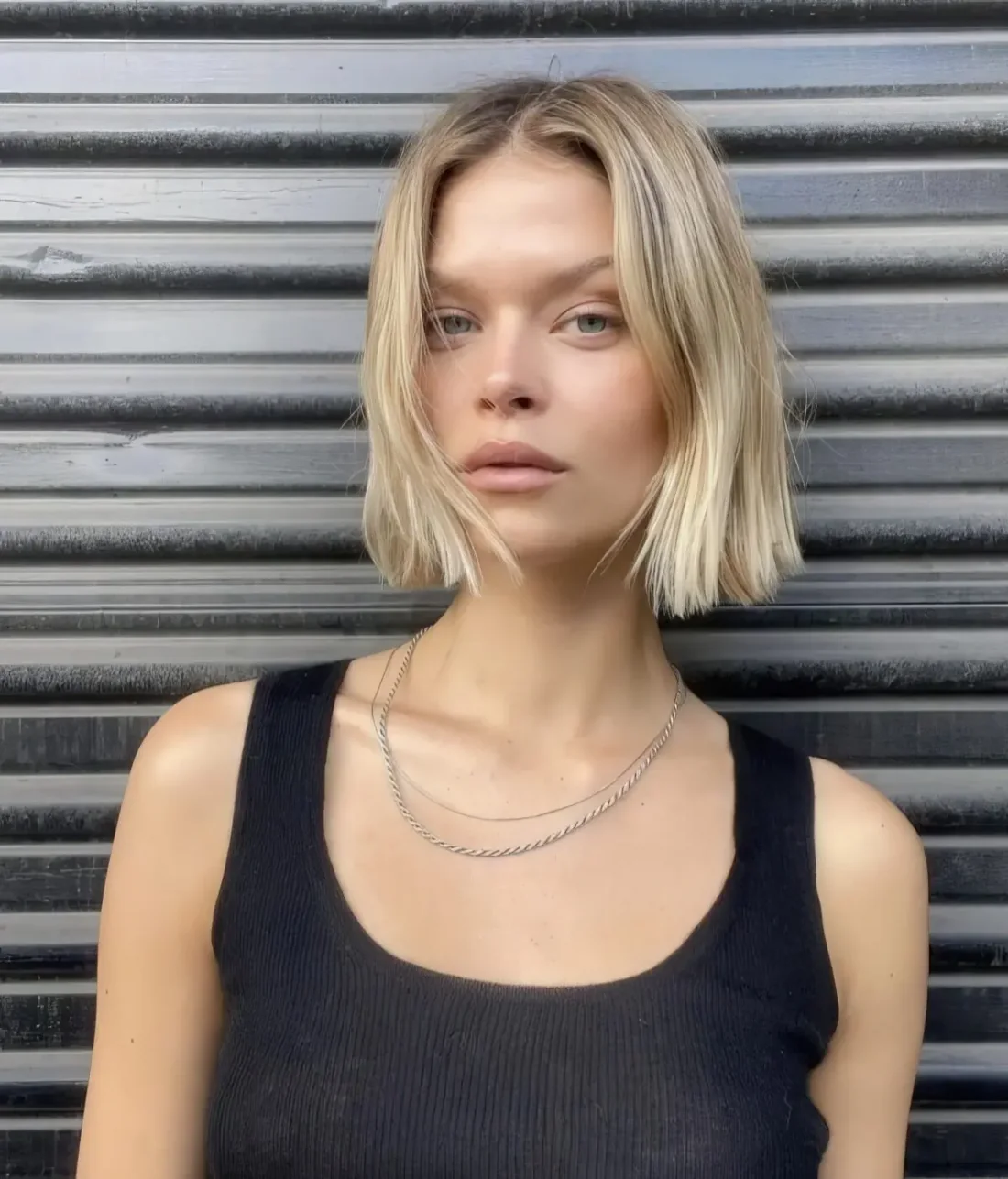 Photo showing messy blonde chin bob, with the hairstyle clearly visible.