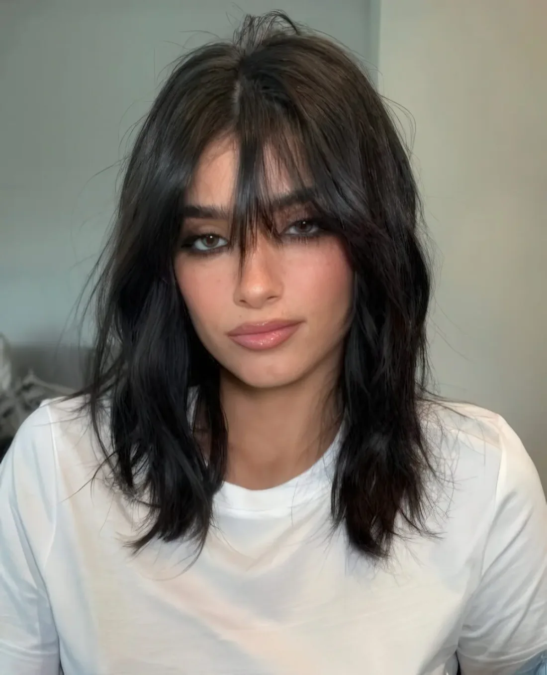Photo showing black medium hair, with the hairstyle clearly visible.