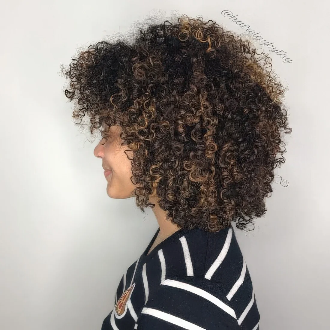 Rounded bob shape with a trendy bang and fun layers.