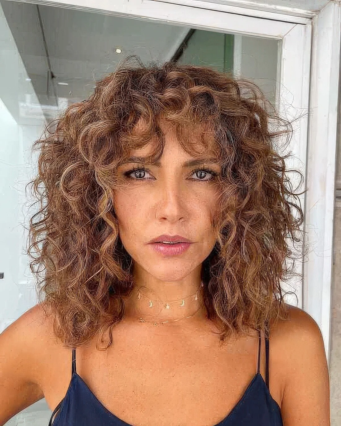 Boho curly lob with shorter layers going into a shaggy curly bob for some texture for more flattering loioks.