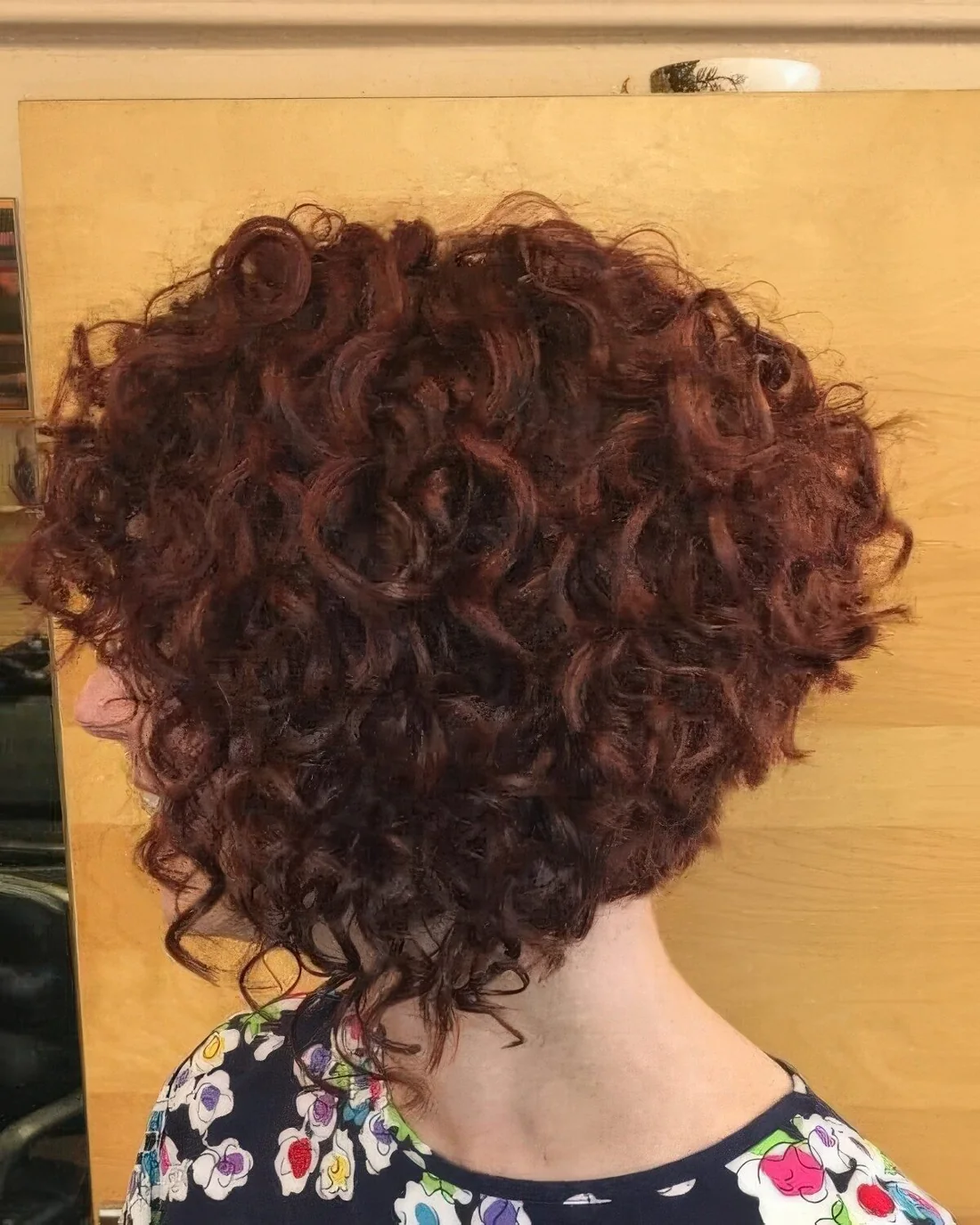 Photo showing dark ginger A line bob, with the hairstyle clearly visible.