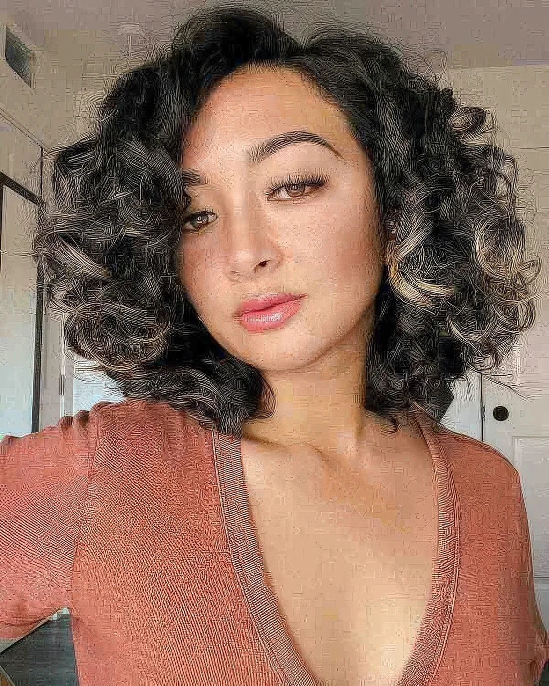 Deep side parted curly long bob with some highlights to bring new life to natural curls.