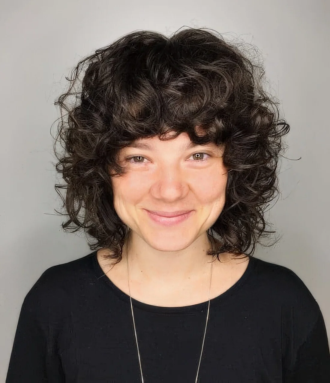 Modern take on a 70s curly shaggy bob.