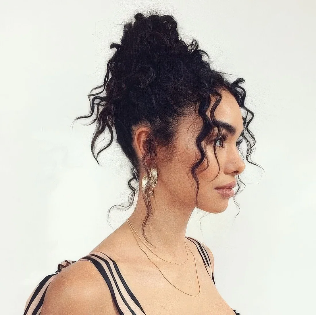 Photo showing messy top knot, with the hairstyle clearly visible.