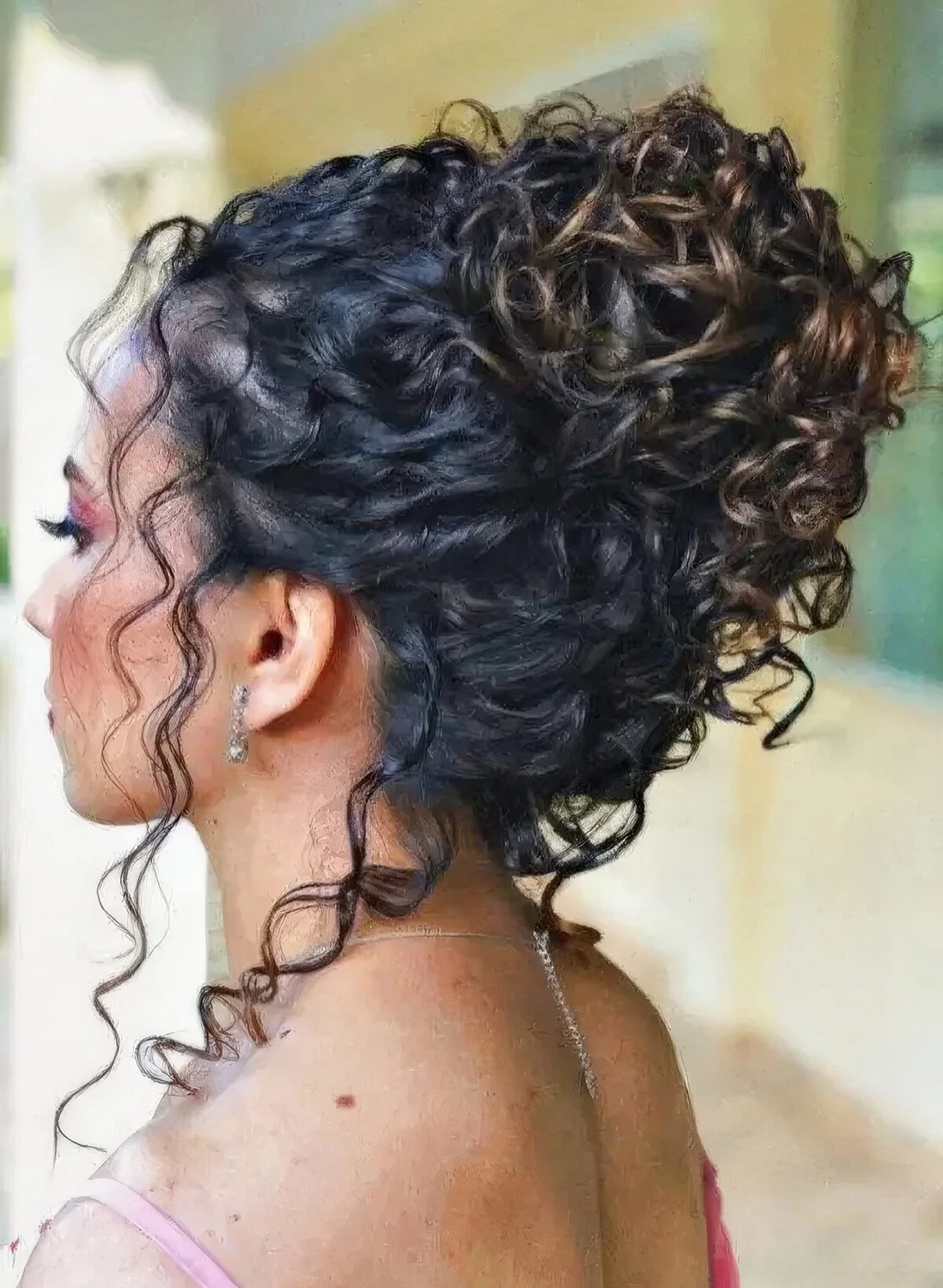 Photo showing curly updo with some curls down, with the hairstyle clearly visible.