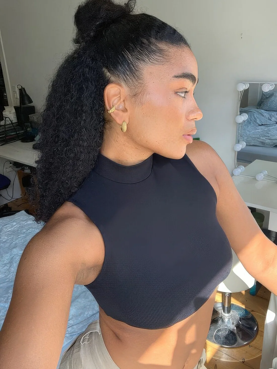 Photo showing simple half-up hairstyle, with the hairstyle clearly visible.