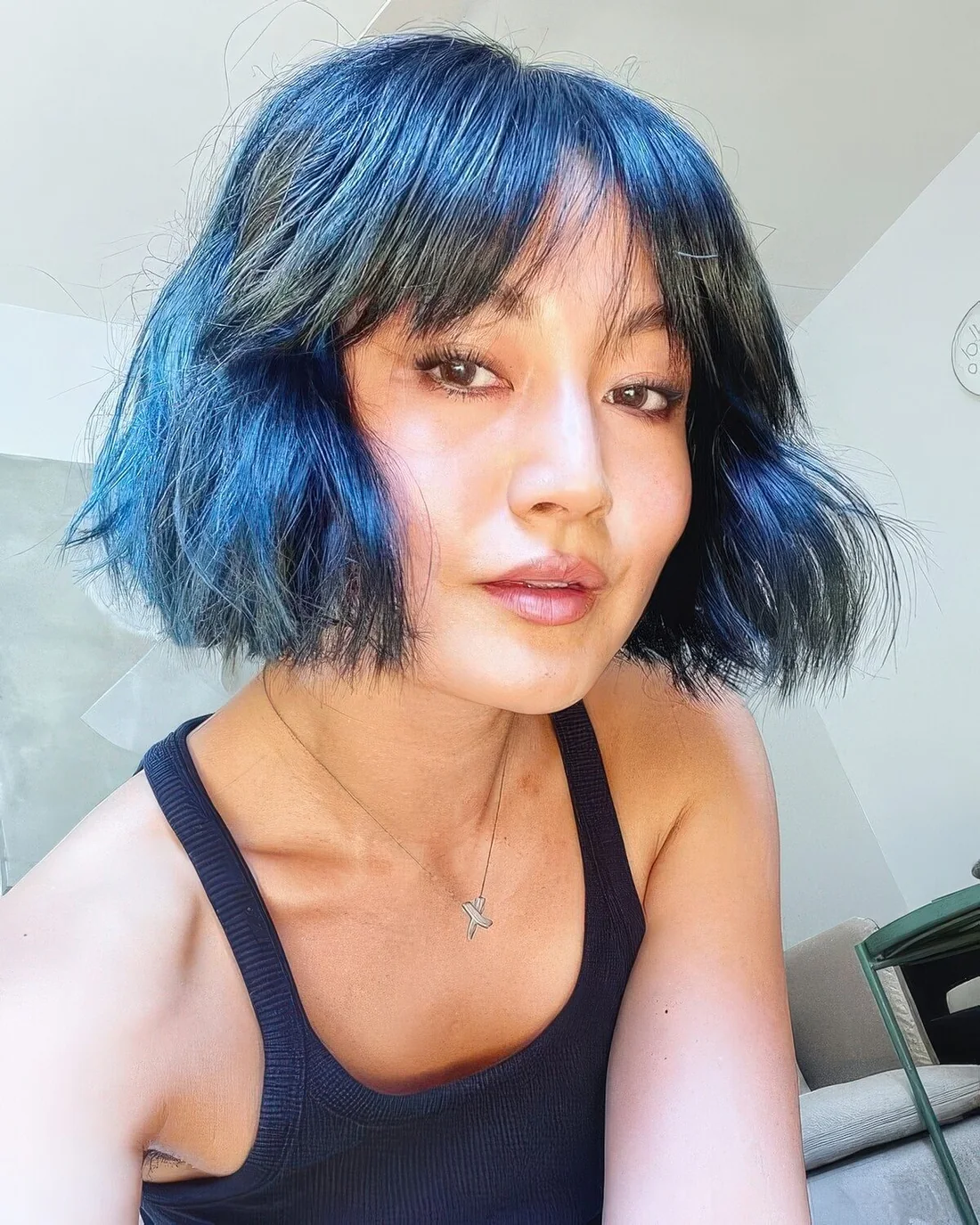 Photo showing short blue hairstyle, with the hairstyle clearly visible.
