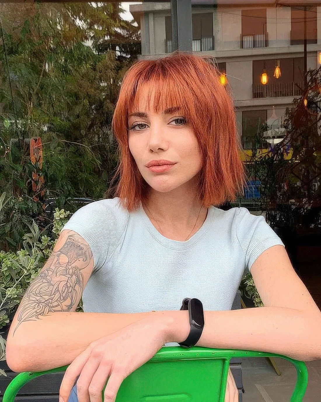 Shaggy textured ginger bob with wispy bangs.