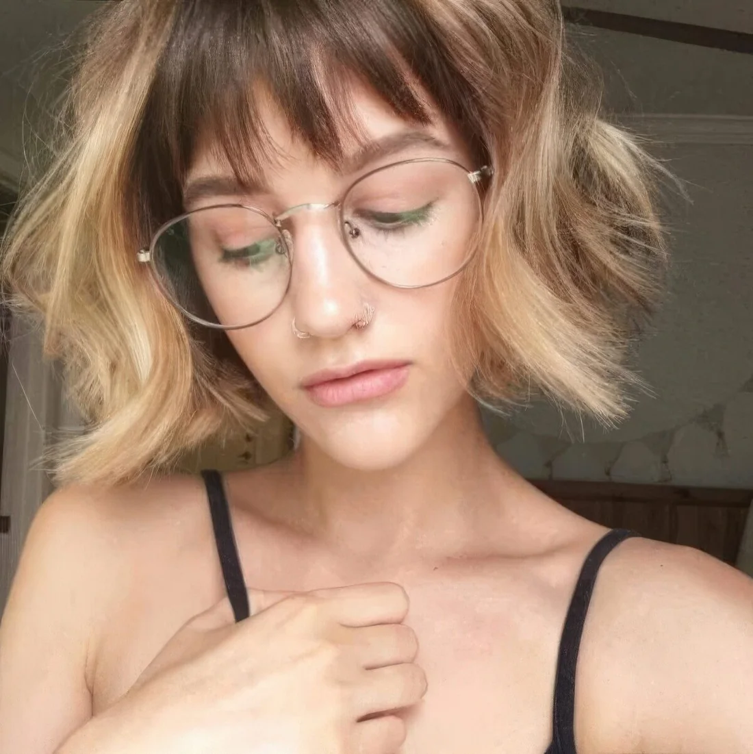 Short blonde bob with dark lowlights and see through wispy bangs.