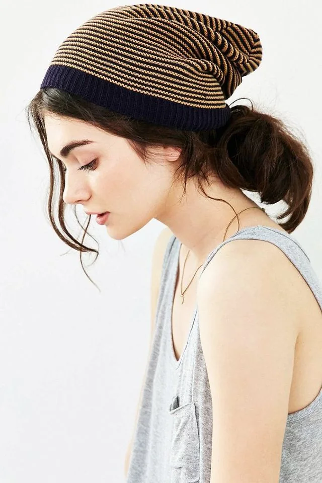 Messy low bun hairstyle for winter.