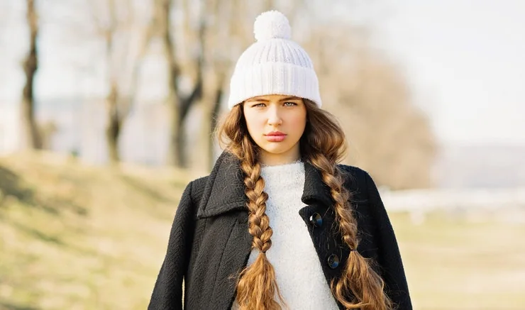 Loose braids always look chic under a beanie.