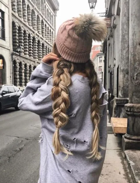 Photo showing two large braids, with the hairstyle clearly visible.