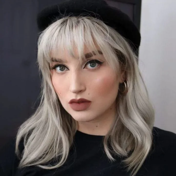 Photo showing icy blonde hairstyle, with the hairstyle clearly visible.