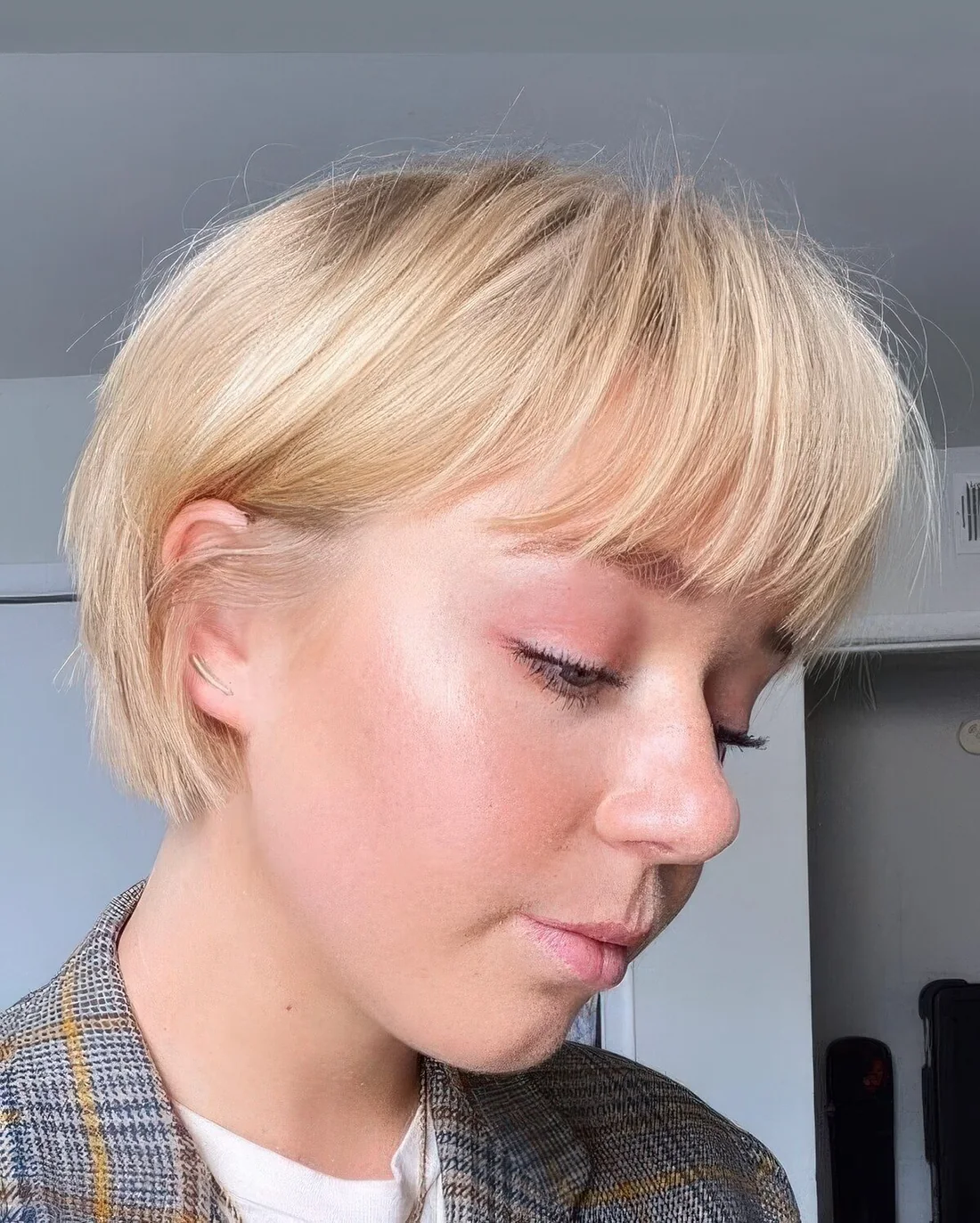 Classic blonde ear-length bob with a classic fringe.