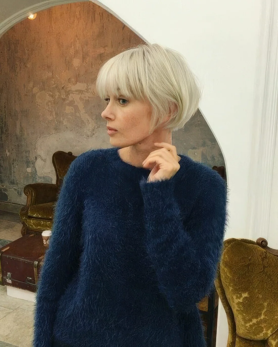 Textural platinum blonde ear-length bob with a classic outgrown fringe.