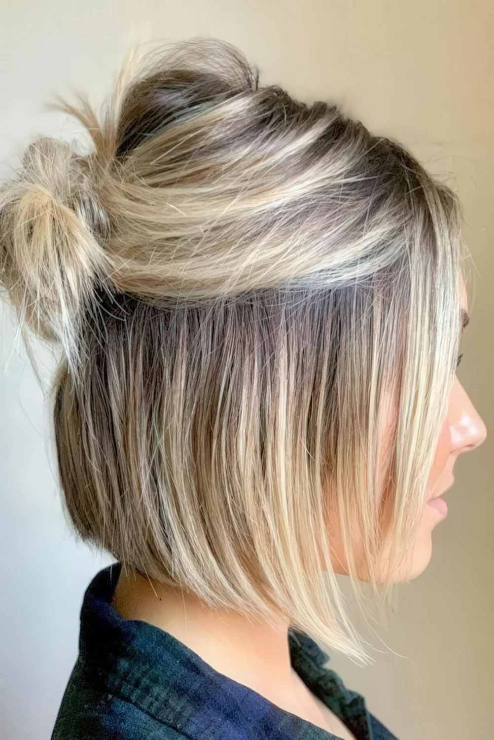 Messy half updo with a knot, a messy bump and hair down for everyday wearing.