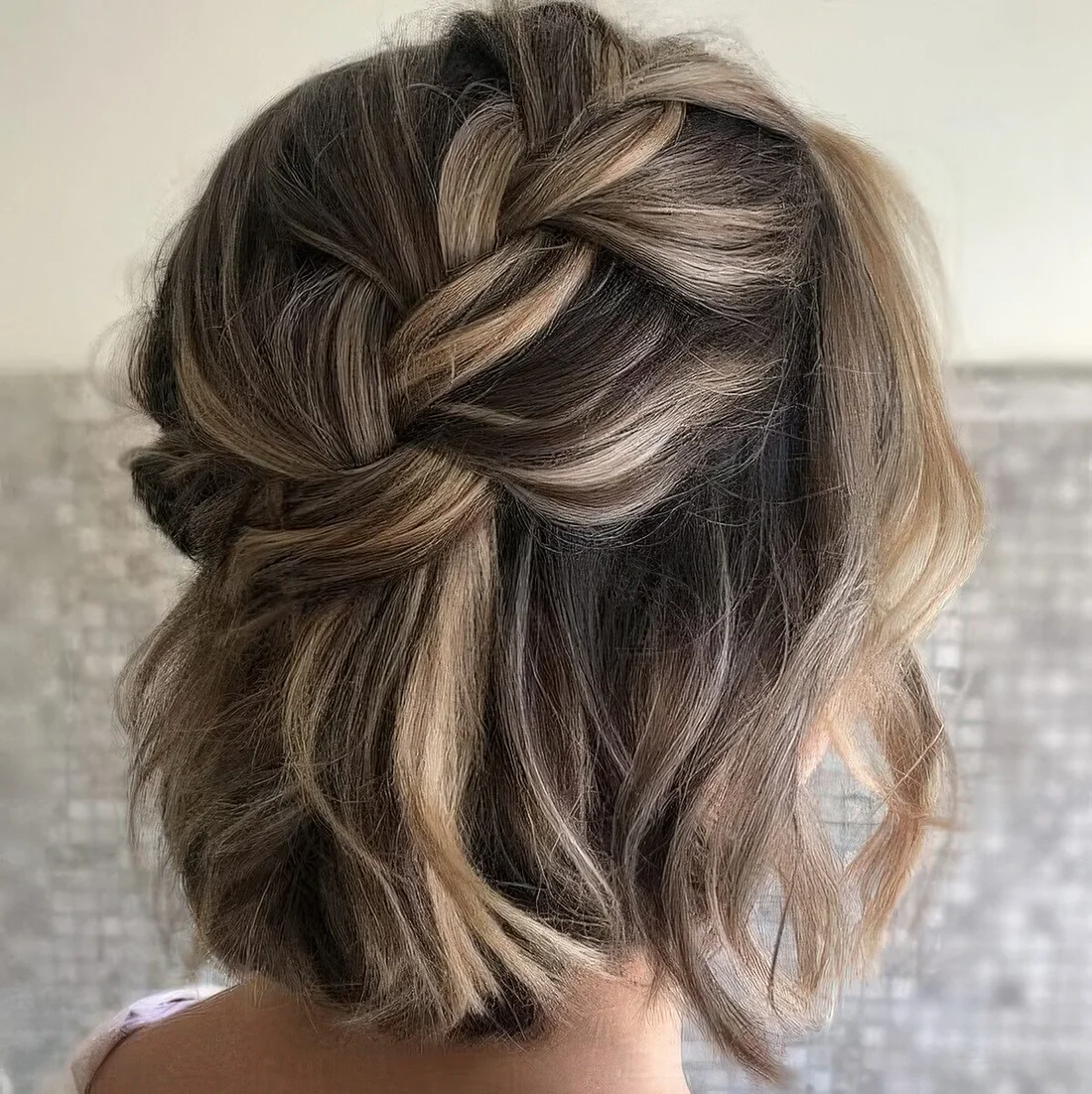 Loose braided halo half updo with waves and some volume.
