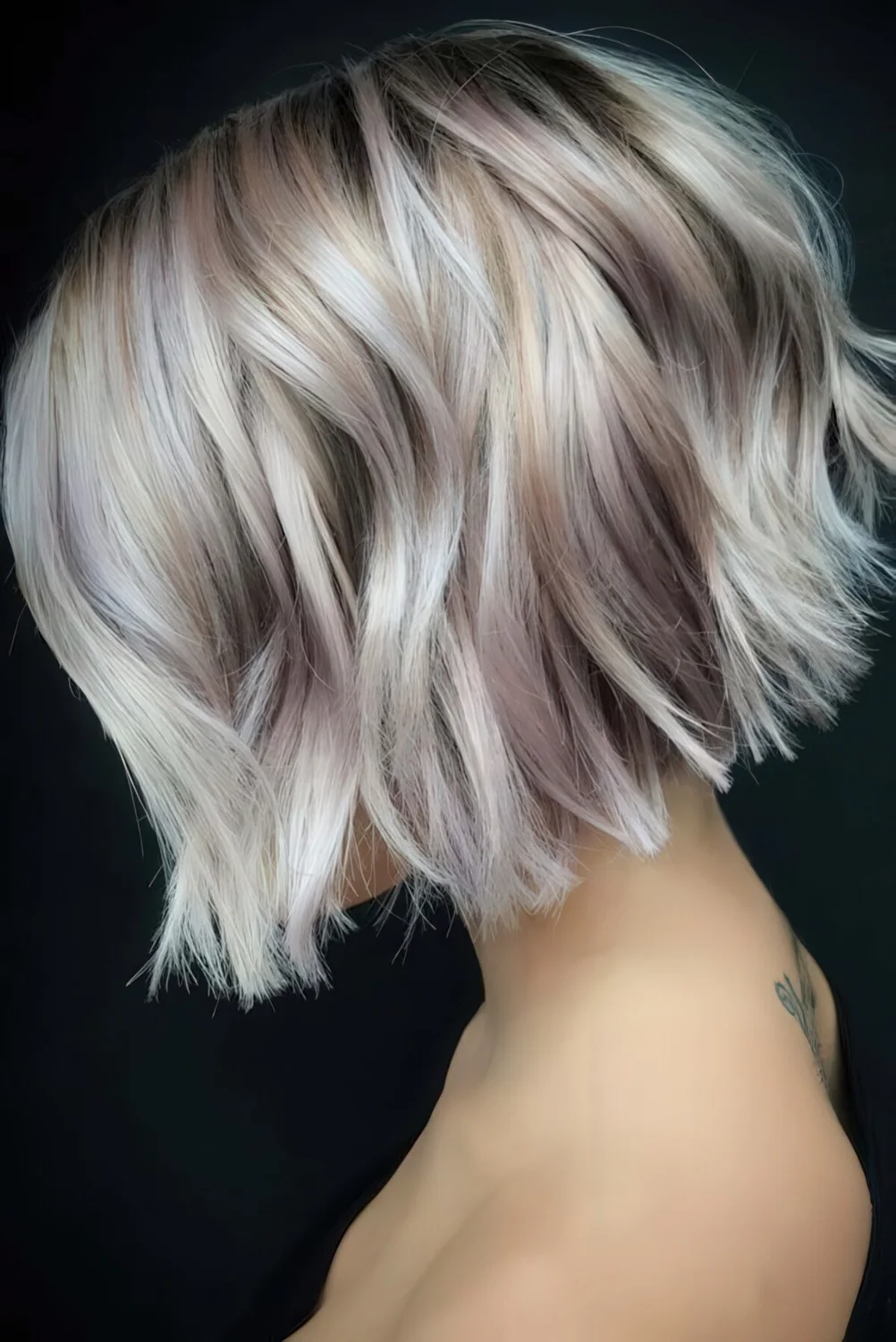 Impressive short bob with blush and silver balayage and waves.