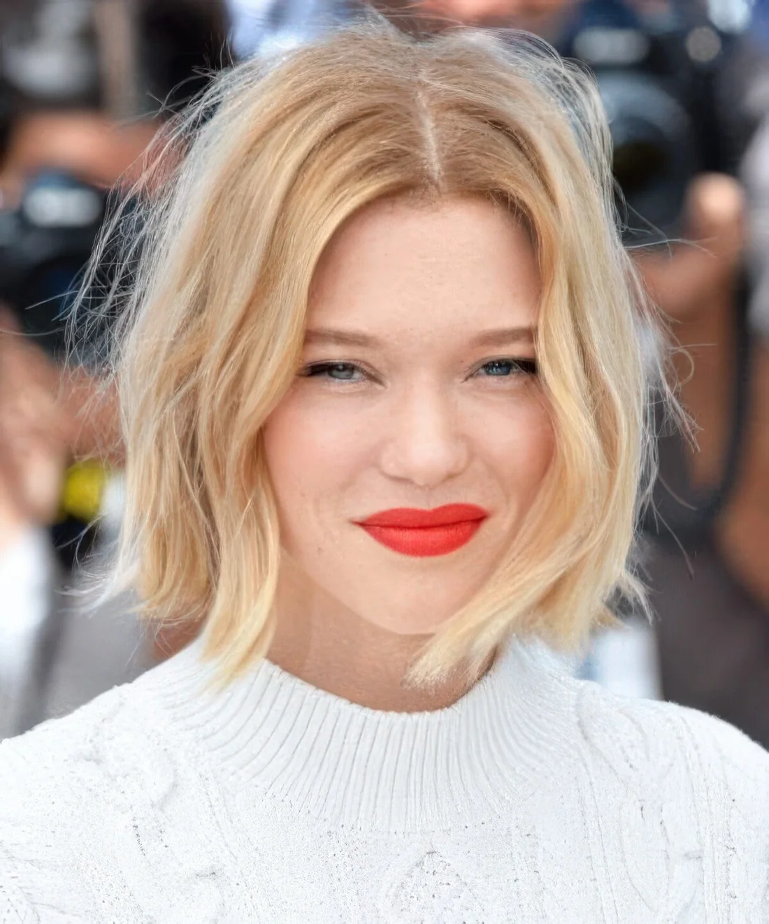 Ginger hair with platinum balayage and face framign highlights and beach waves.