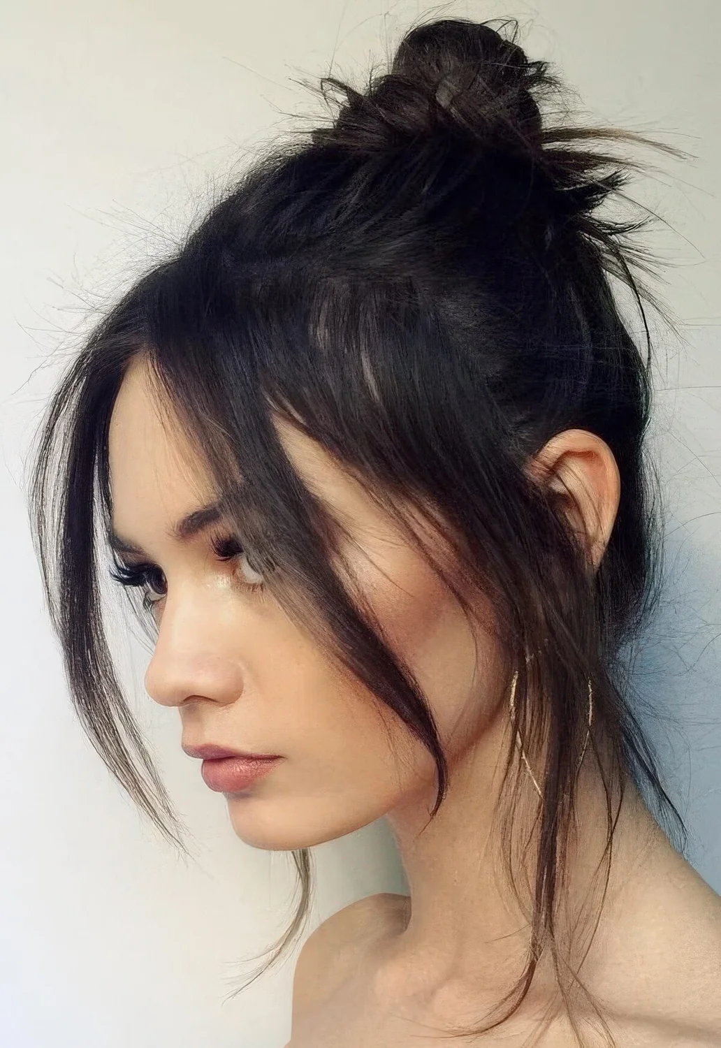 Photo showing casual top knot hairstyle, with the hairstyle clearly visible.
