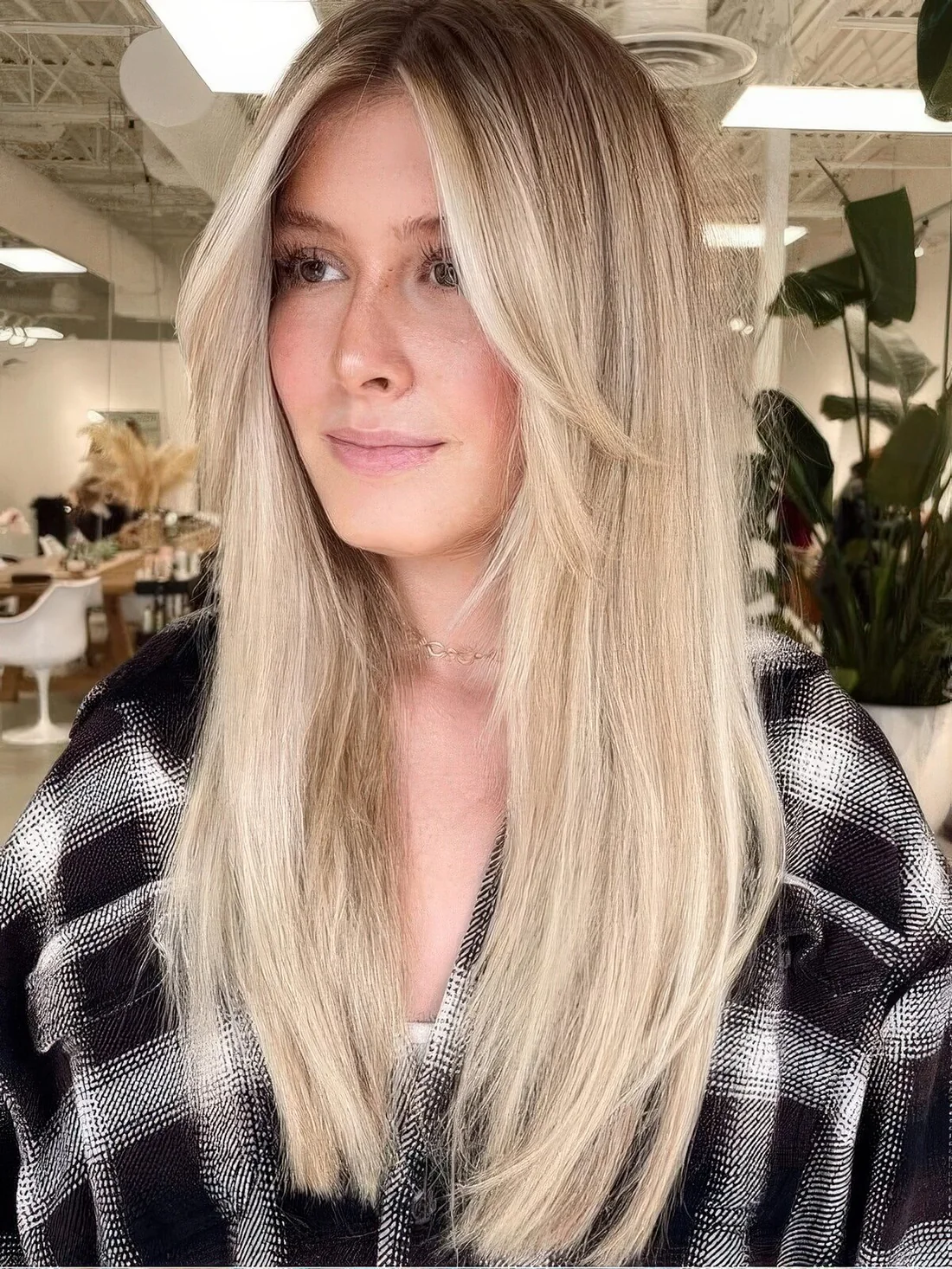 Long blonde hair with layers framing the face.