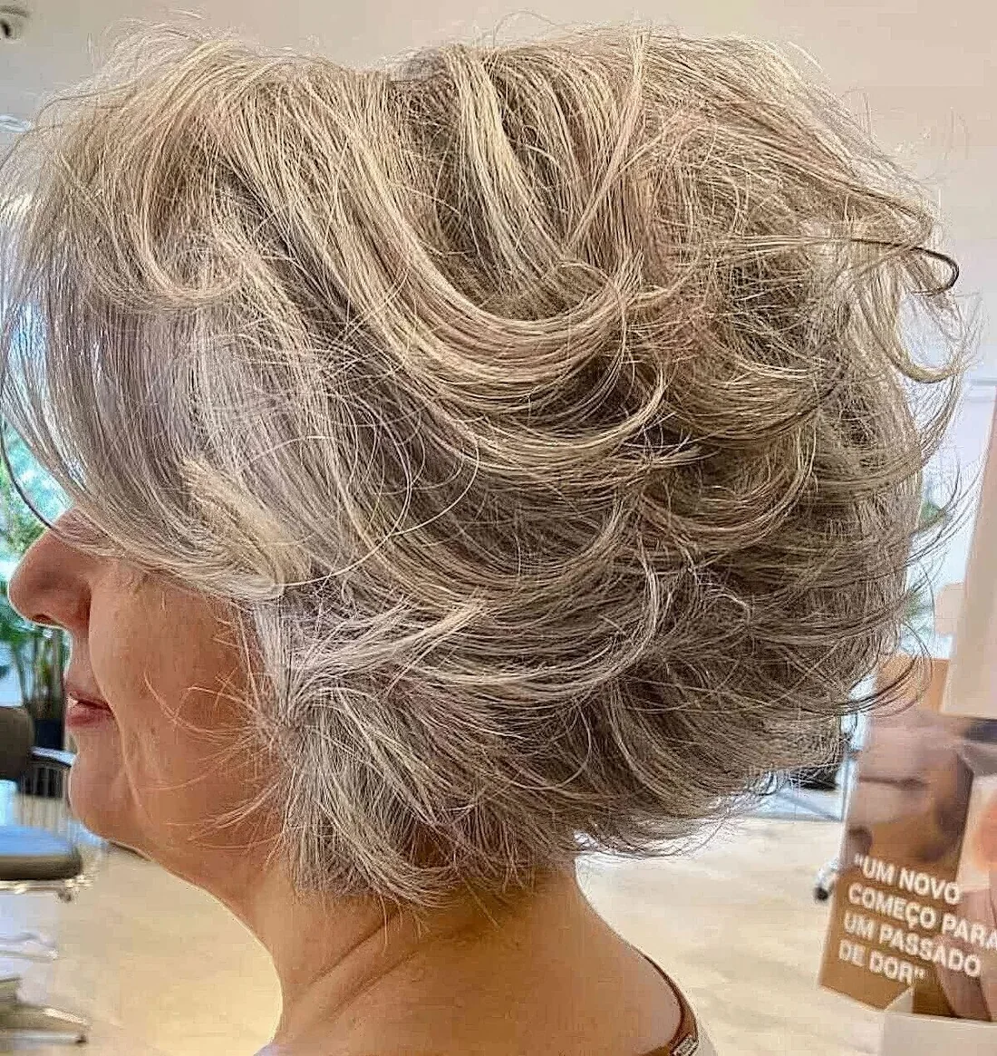 Photo showing graduated messy feathered bob, with the hairstyle clearly visible.