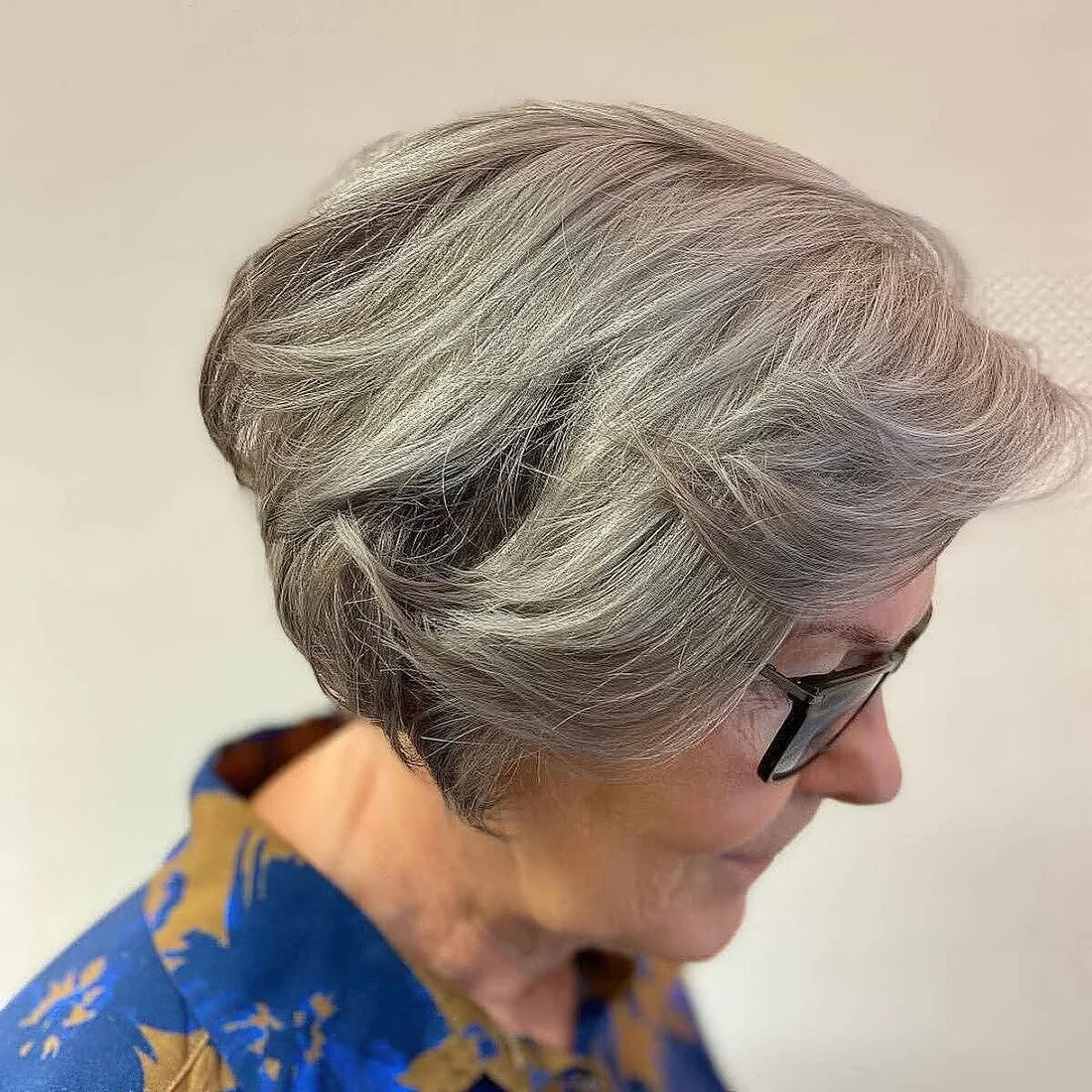 Photo showing layered cut with feathered bangs, with the hairstyle clearly visible.