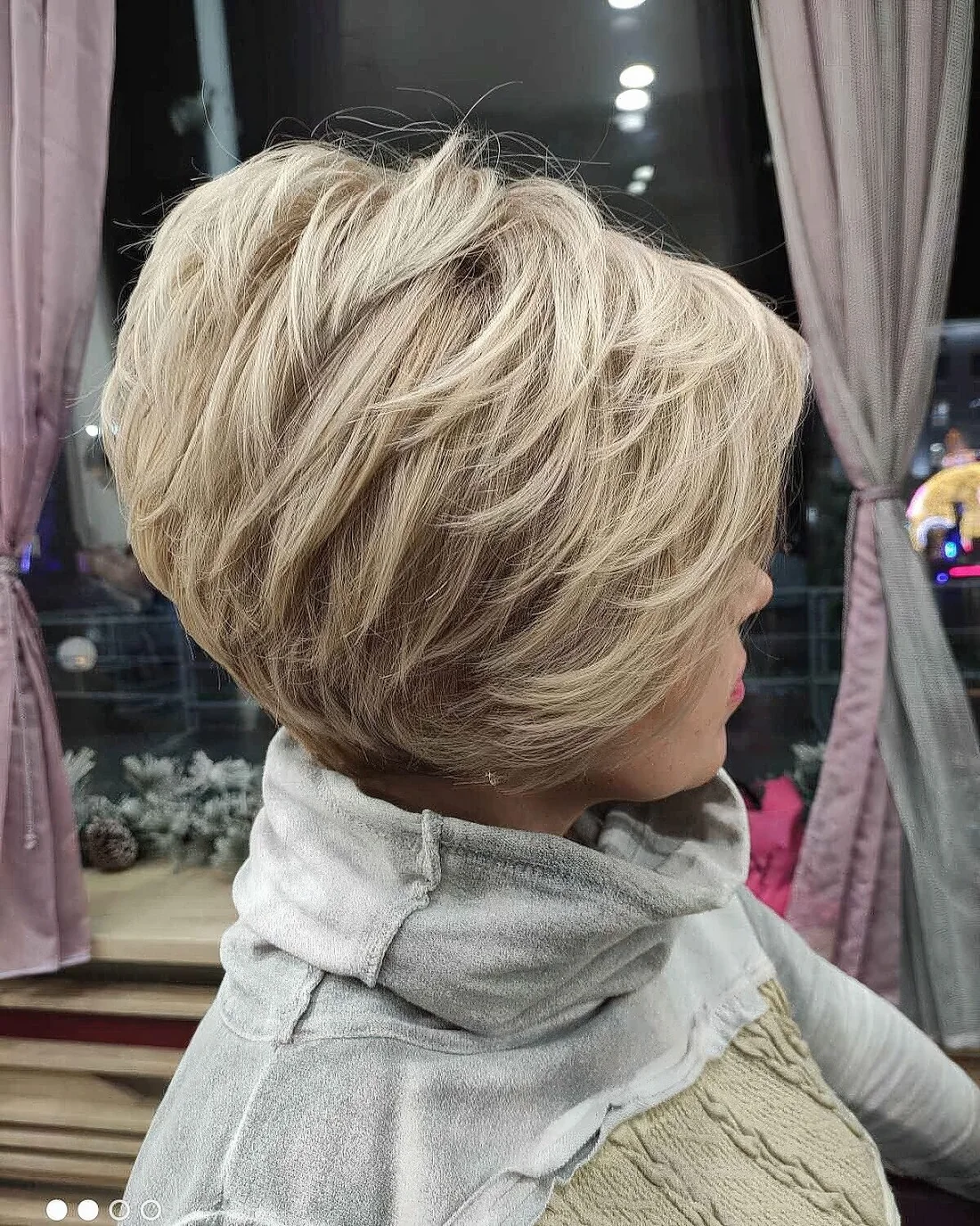 Short feathered bob with textured layers.