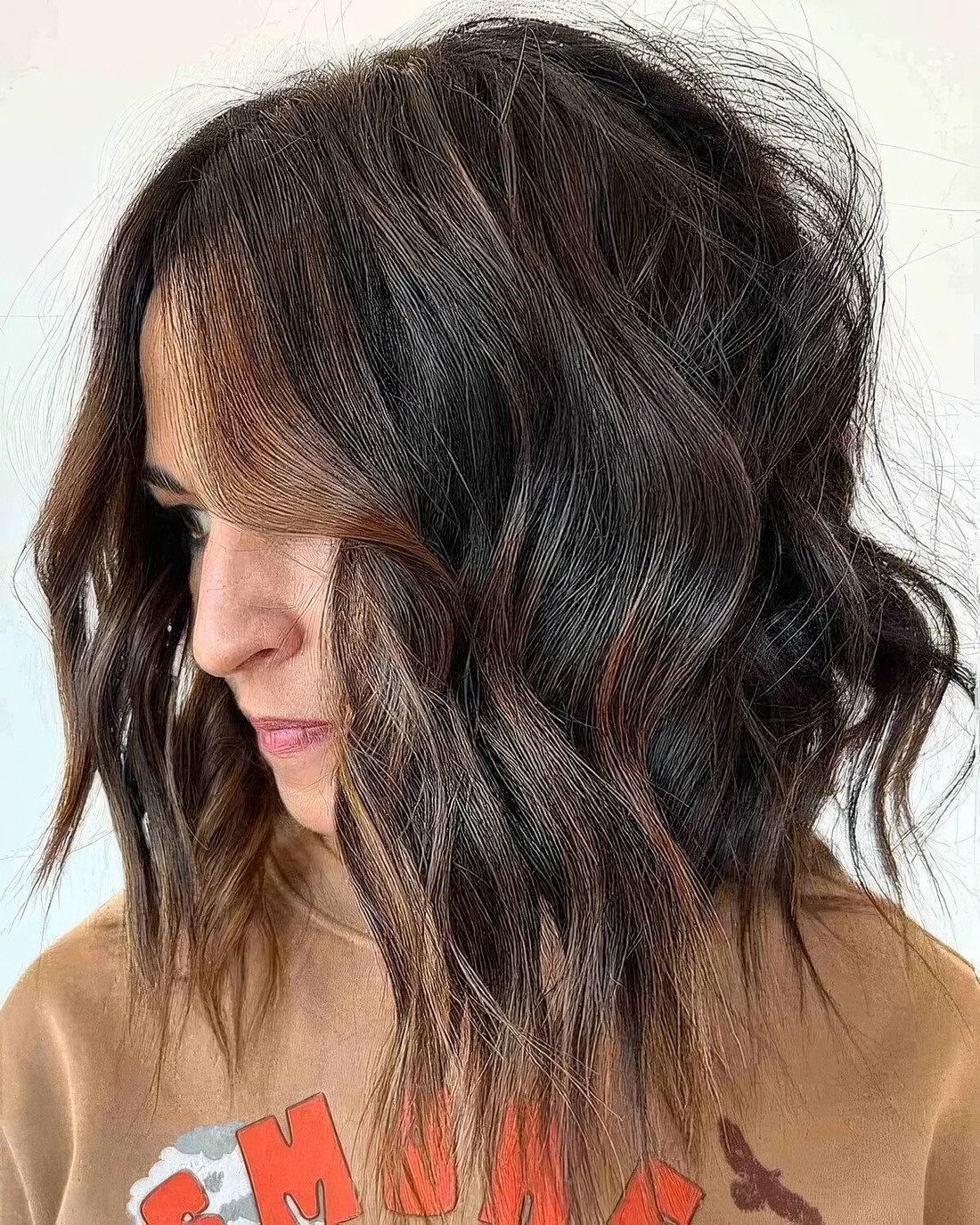 Tousled long bob with chunky layers.