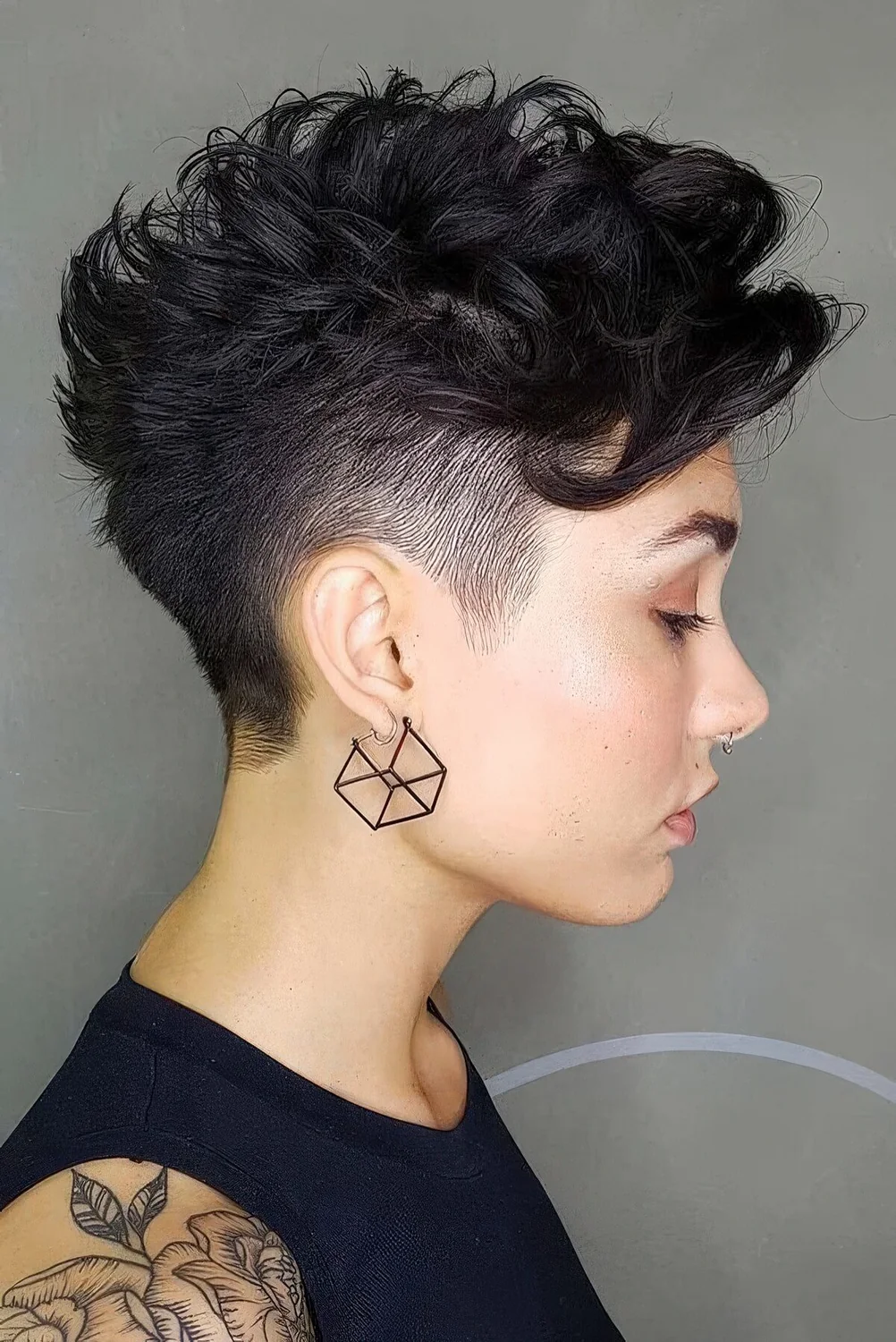 Photo showing wavy pixie with an undercut, with the hairstyle clearly visible.