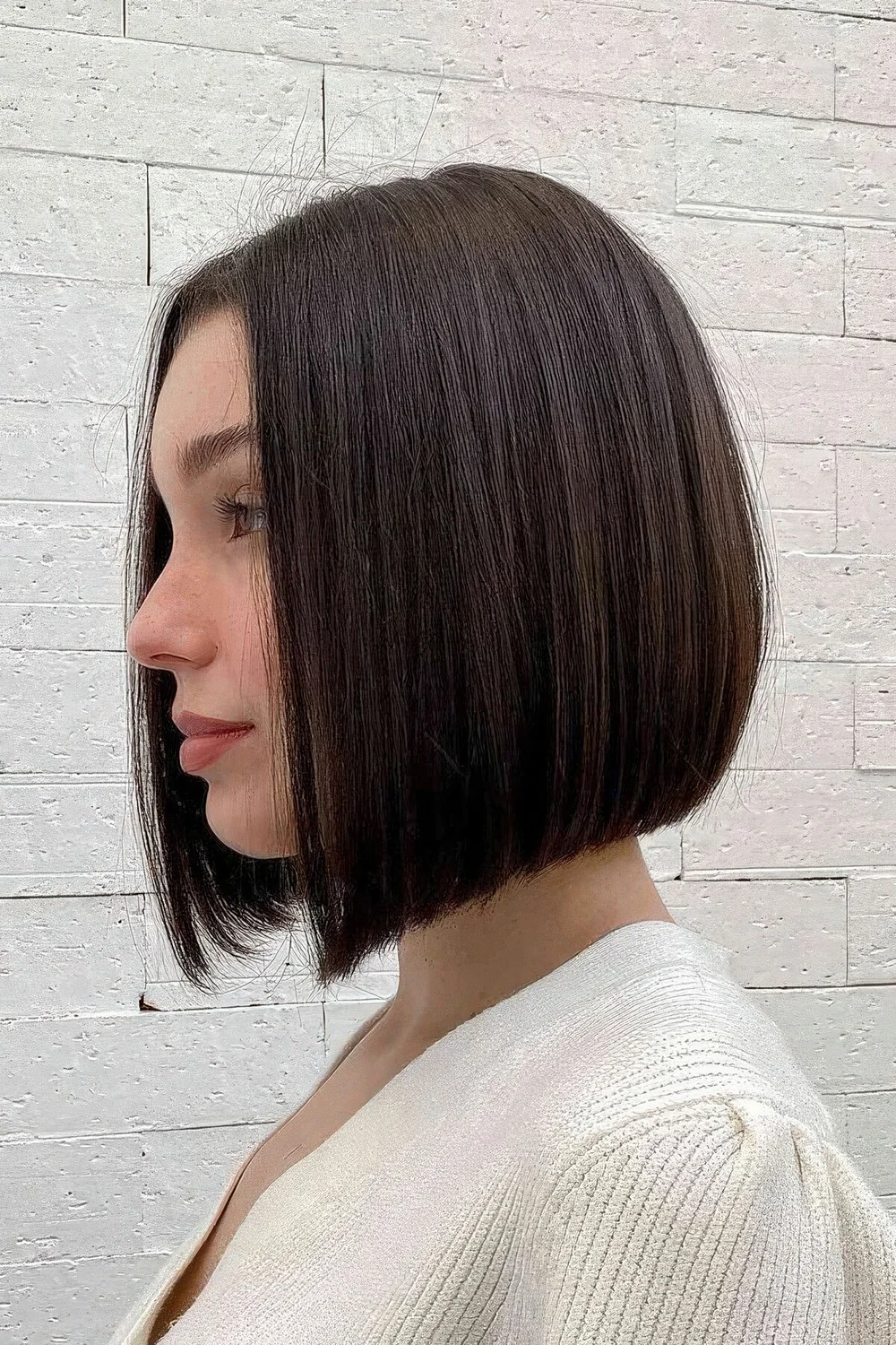 Photo showing line bob with minimal layers, with the hairstyle clearly visible.