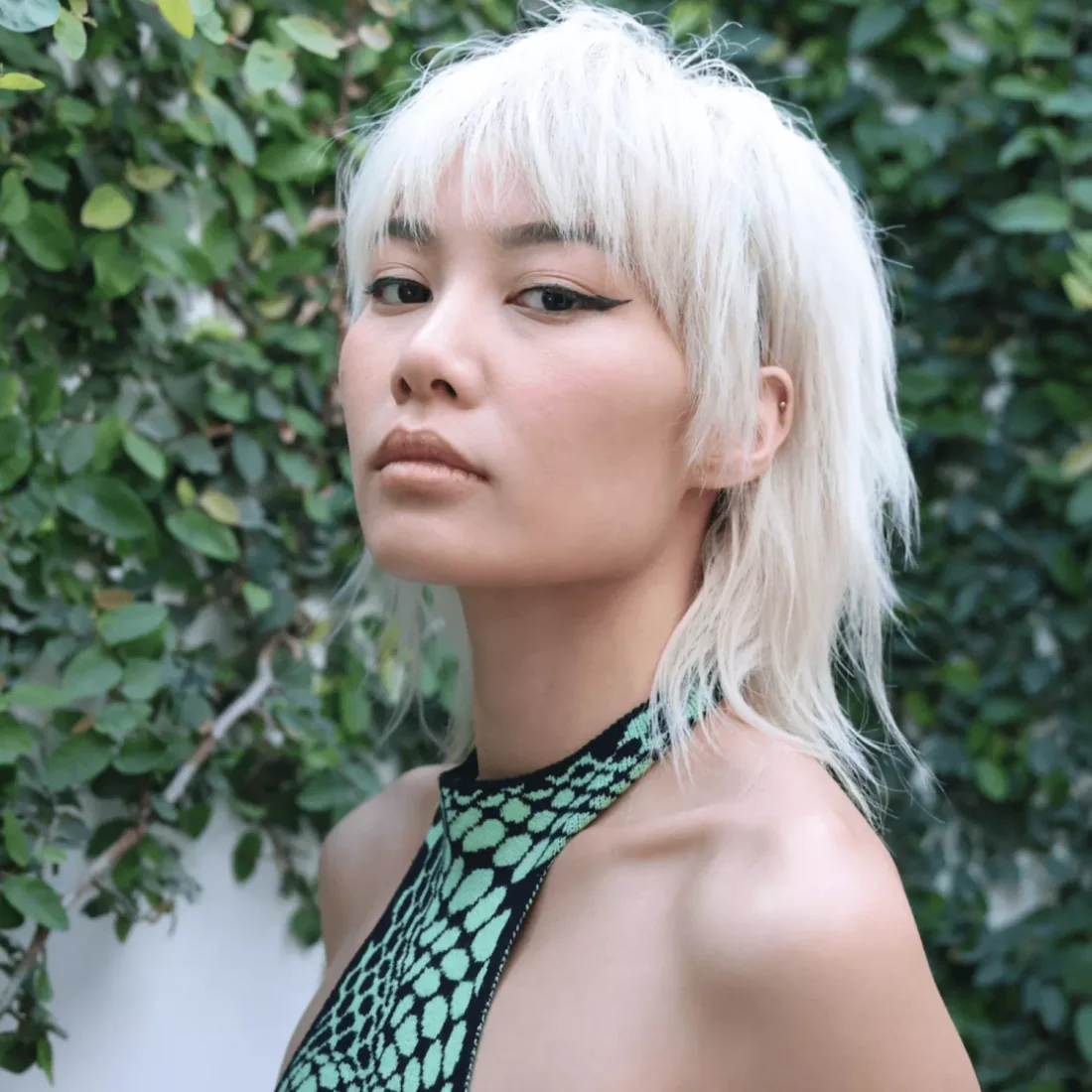 Platinum shag with fine airy layers and a full wispy fringe.